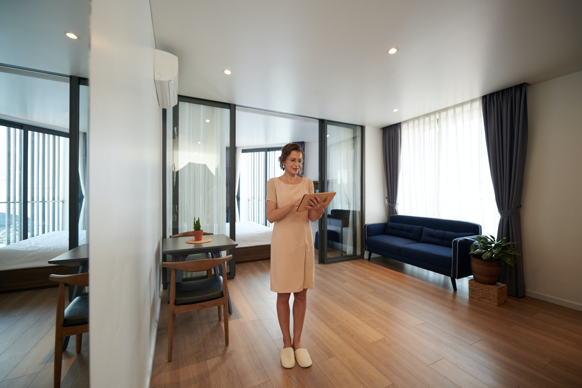 woman-setting-smart-home-application.jpg