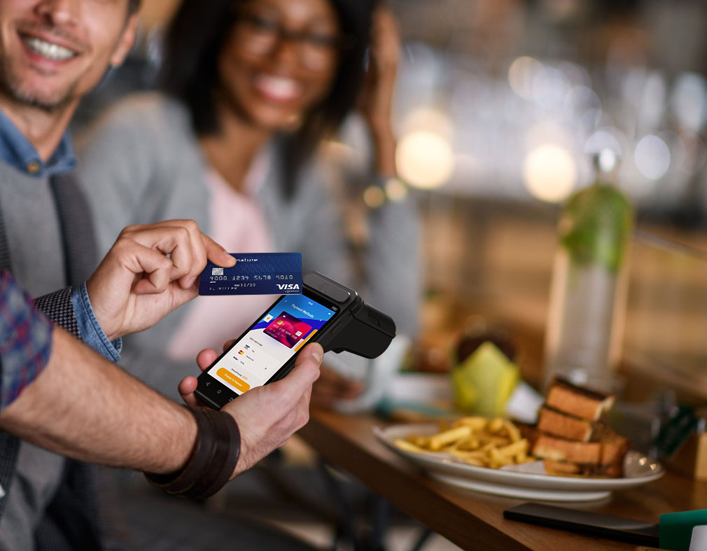 restaurant waiter taking table order with handheld POS